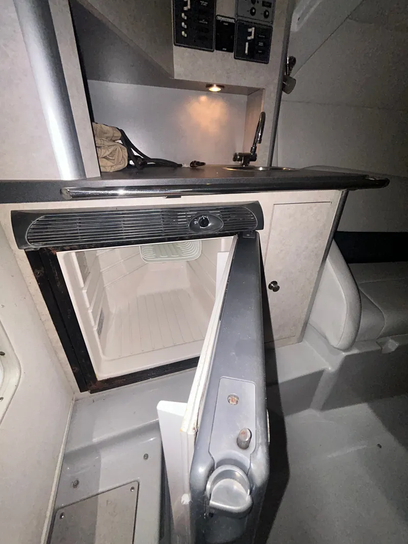 Slide: The Image of Interior of a 2006 Baja 30 Outlaw with refrigerator. - 30