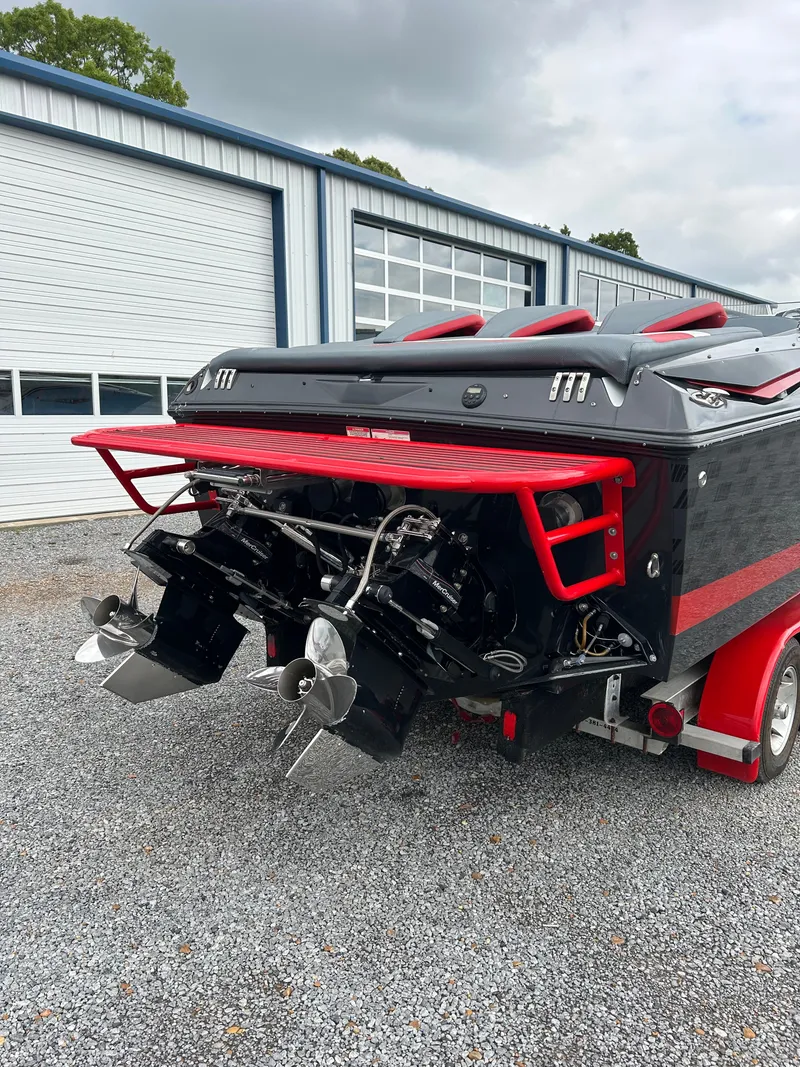 Slide: The Image of 2006 Baja 30 Outlaw boat with dual engines on trailer. - 5