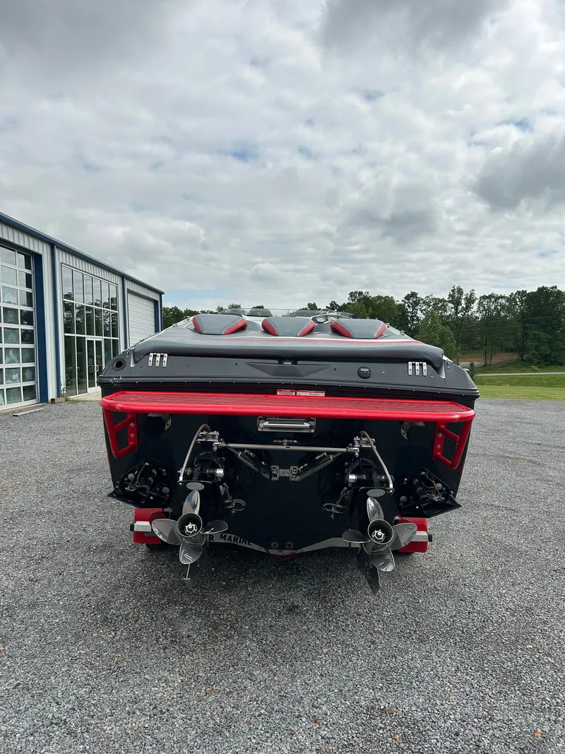 Slide: The Image of Rear view of a 2006 Baja 30 Outlaw boat on gravel surface. - 6