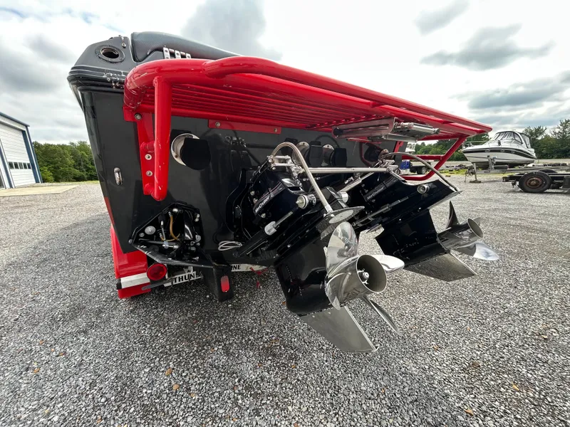 Slide: The Image of Rear view of a 2006 Baja 30 Outlaw boat with dual engines. - 7