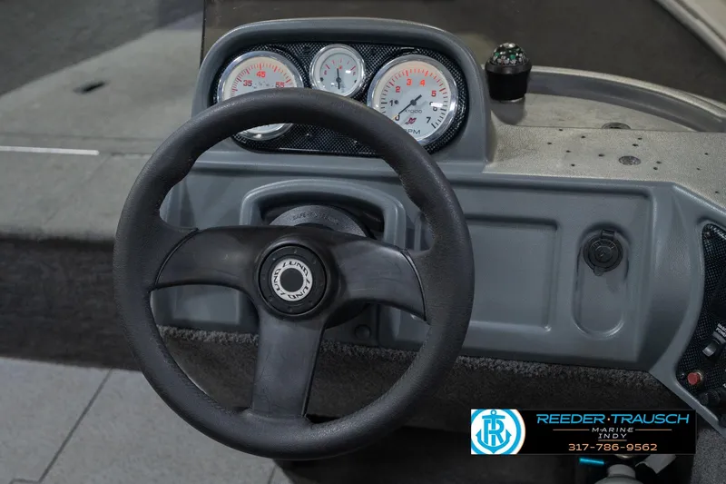 Slide: The Image of Steering wheel and dashboard of 2013 Lund 1650 Rebel XL Sport boat. - 26