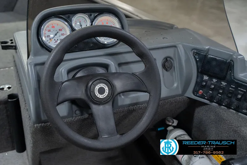 Slide: The Image of Steering console of 2013 Lund 1650 Rebel XL Sport boat with gauges and controls. - 27
