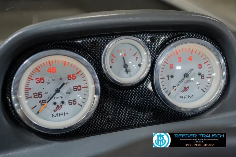 Slide: The Image of Dashboard gauges of 2013 Lund 1650 Rebel XL Sport boat, featuring speedometer, fuel, and RPM indicators. - 29