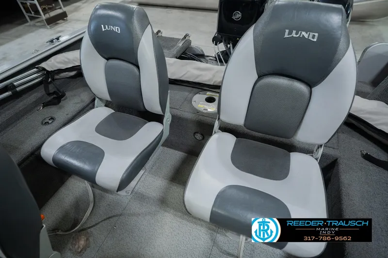 Slide: The Image of Two gray and black seats in a 2013 Lund 1650 Rebel XL Sport boat. - 34