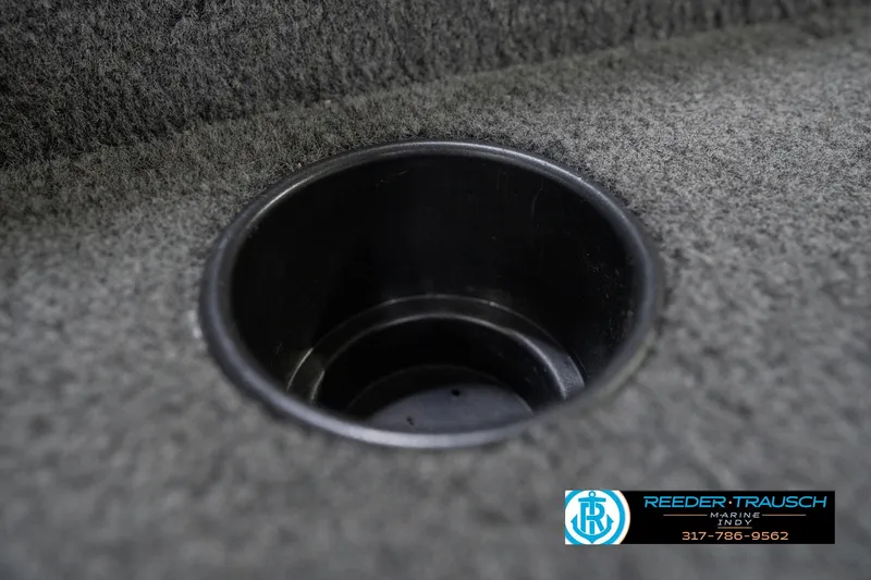 Slide: The Image of Cup holder in 2013 Lund 1650 Rebel XL Sport boat with carpeted interior. - 35