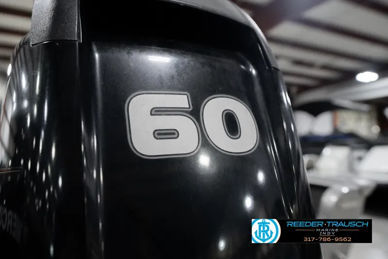 Slide: The Image of Close-up of a 60 HP outboard motor on a 2013 Lund 1650 Rebel XL Sport boat. - 39