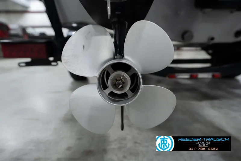 Slide: The Image of 2013 Lund 1650 Rebel XL Sport boat propeller in a showroom setting. - 44