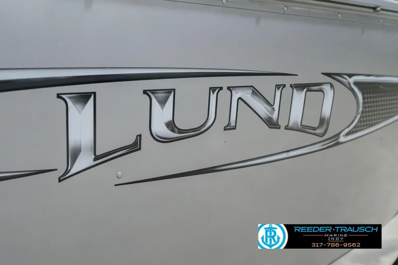 Slide: The Image of 2013 Lund 1650 Rebel XL Sport boat logo with Reeder Trausch Marine contact details. - 45
