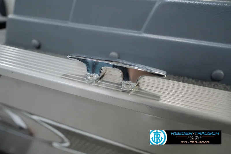 Slide: The Image of Chrome cleat on 2013 Lund 1650 Rebel XL Sport boat, Reeder-Trausch Marine logo visible. - 51