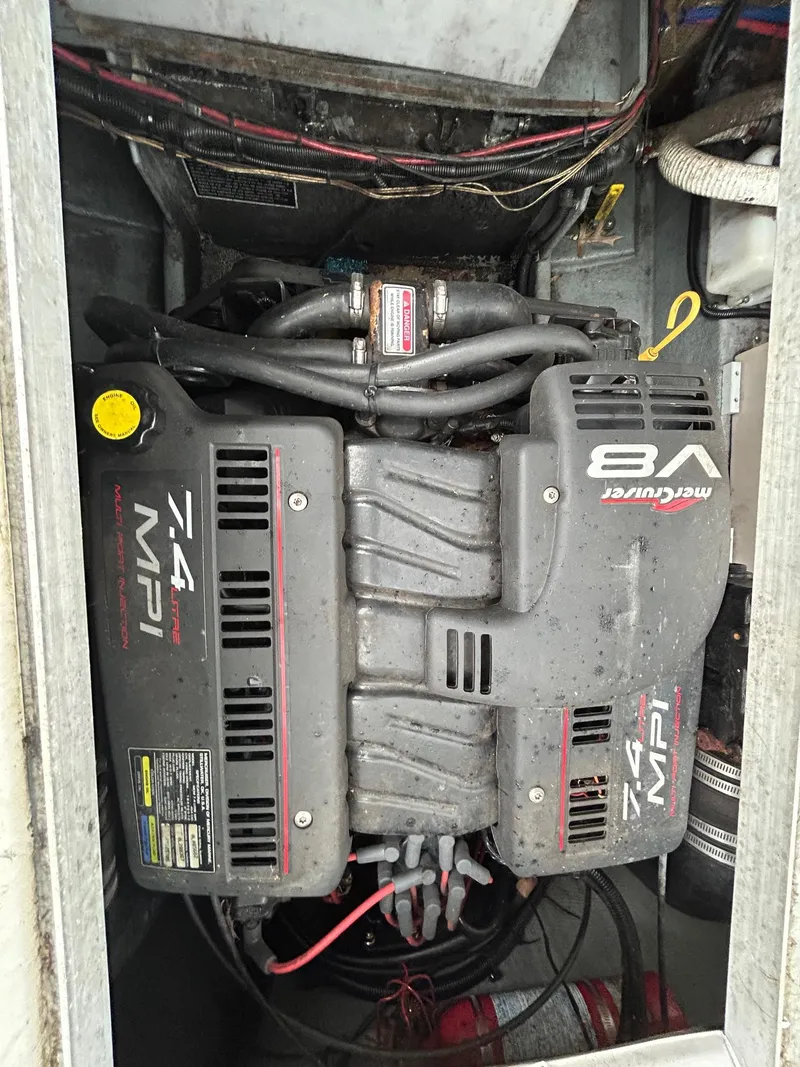 Slide: The Image of 1999 Sea Ray 270 Sundancer engine compartment with MerCruiser 7.4 MPI V8 engine. - 20