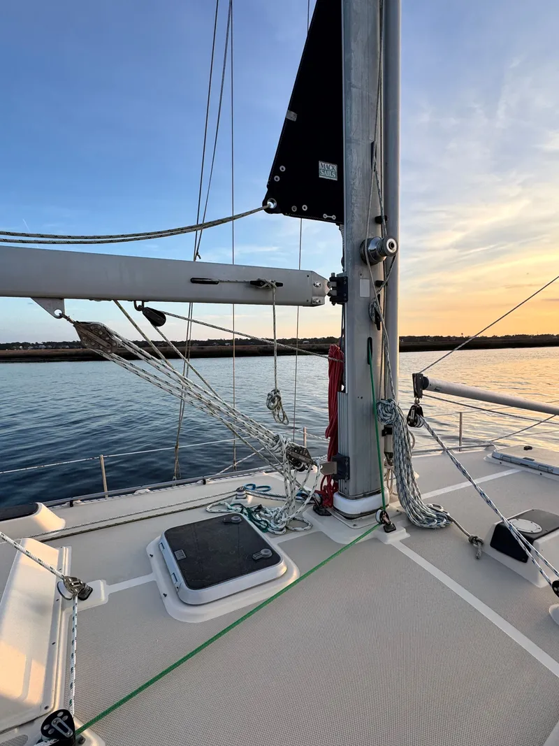 Slide: The Image of Deck of Island Packet 380 sailboat at sunset. - 10