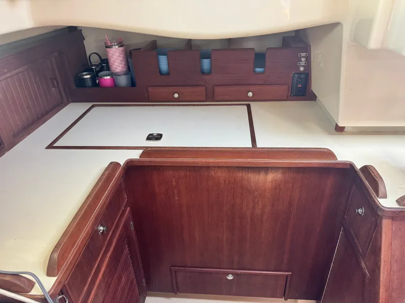 Slide: The Image of Interior of 2001 Island Packet 380 yacht with wooden cabinetry. - 27