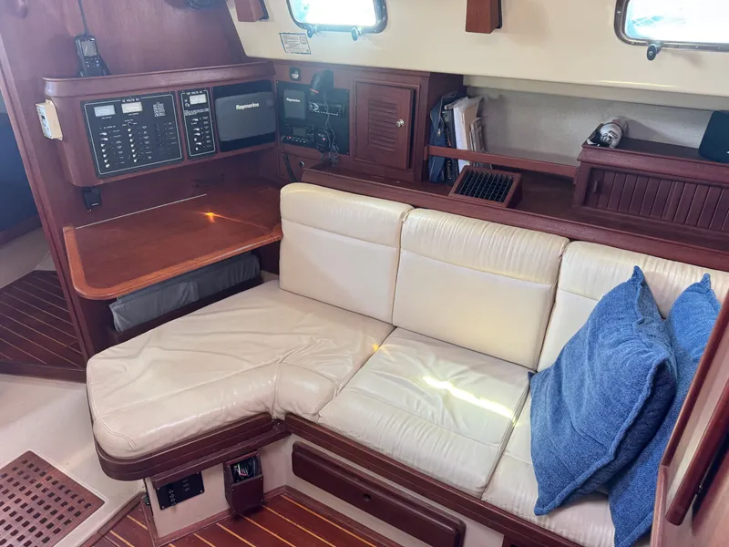 Slide: The Image of Interior of a 2001 Island Packet 380 yacht with leather sofa and navigation area. - 34