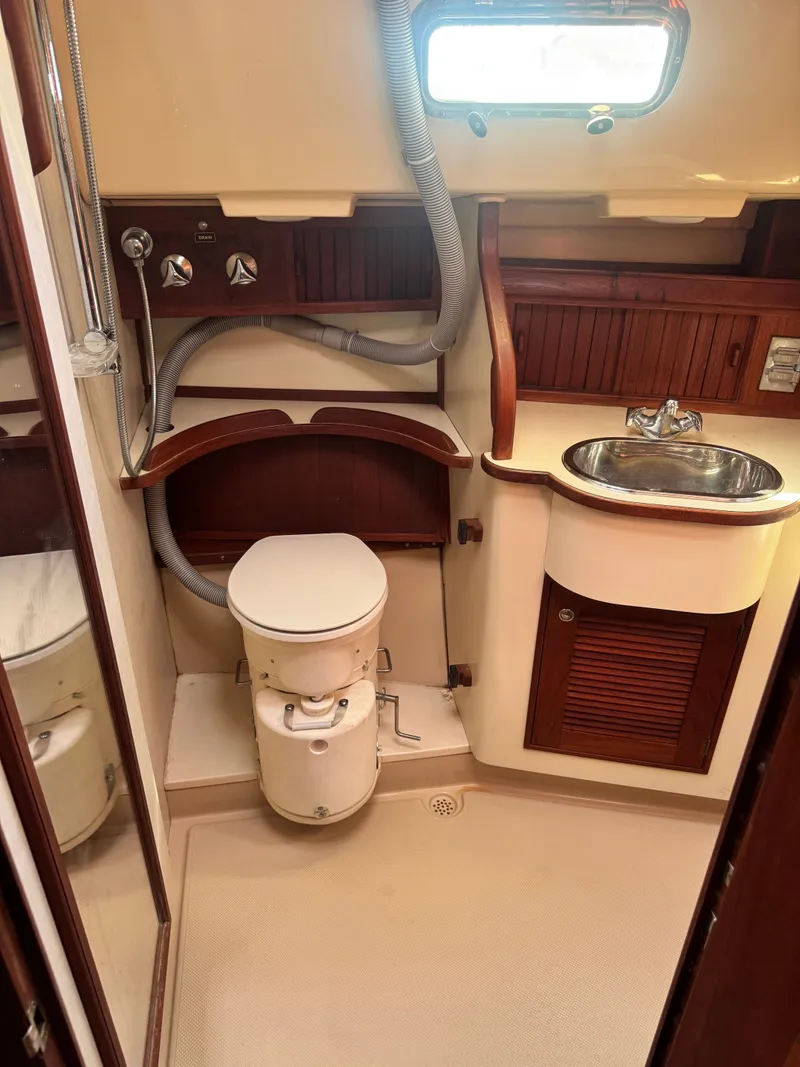 Slide: The Image of Interior of Island Packet 380 yacht, bathroom with toilet and sink, year 2001. - 39