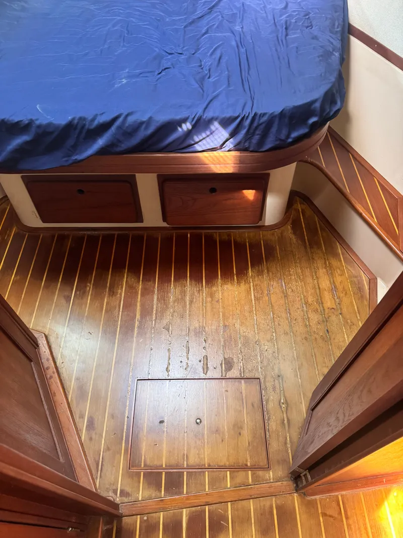 Slide: The Image of Interior of a 2001 Island Packet 380 yacht with wooden flooring and bed. - 41