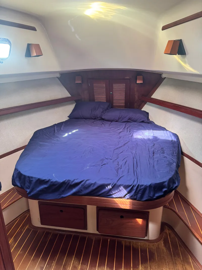 Slide: The Image of Island Packet 380 sailboat cabin, 2001 model, featuring a double bed. - 42