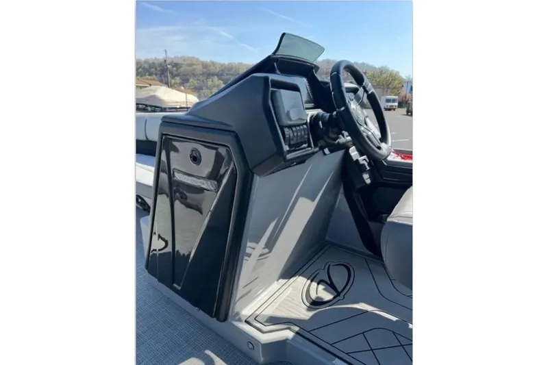 Slide: The Image of 2025 Veranda Relax VR25VLC boat dashboard with steering wheel and control panel. - 12