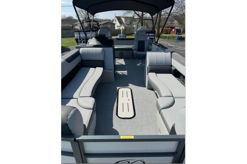 Slide: The Image of 2025 Veranda Relax VR25VLC pontoon boat with spacious seating and canopy. - 13