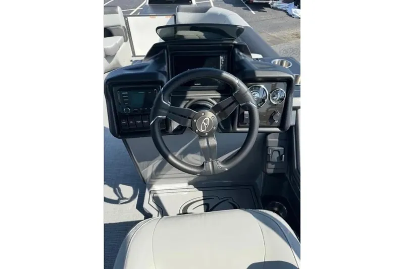Slide: The Image of Steering console of 2025 Veranda Relax VR25VLC pontoon boat with modern controls. - 17