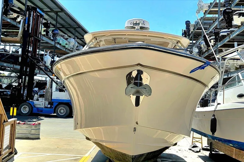 Slide: The Image of 2015 Grady-White Freedom 307 boat in a marina storage facility. - 1