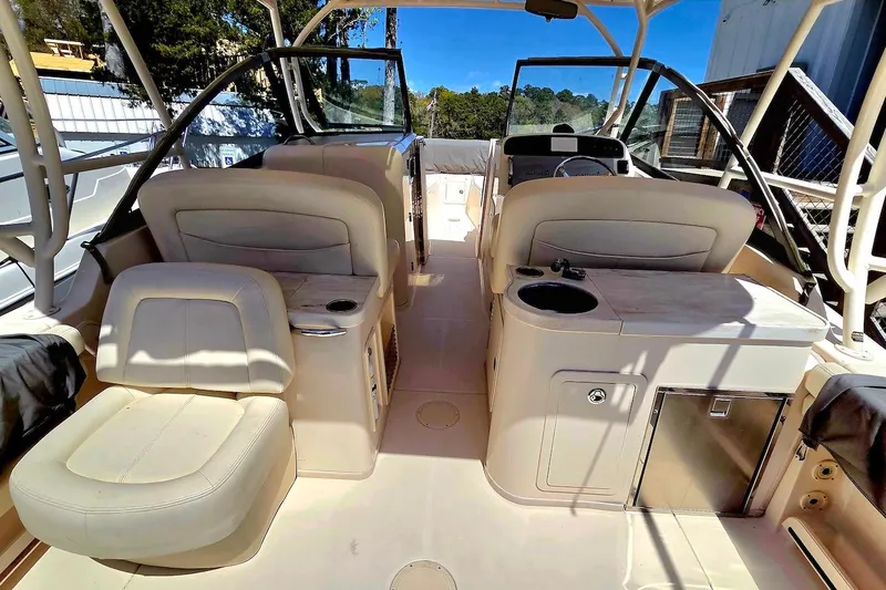 Slide: The Image of 2015 Grady-White Freedom 307 boat interior with seating and helm station. - 10