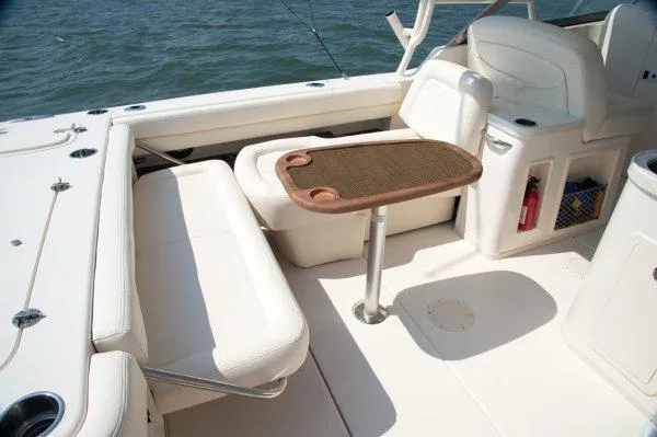 Slide: The Image of Manufacturer Provided Image: 2015 Grady-White Freedom 307 boat interior with seating and table. - 12