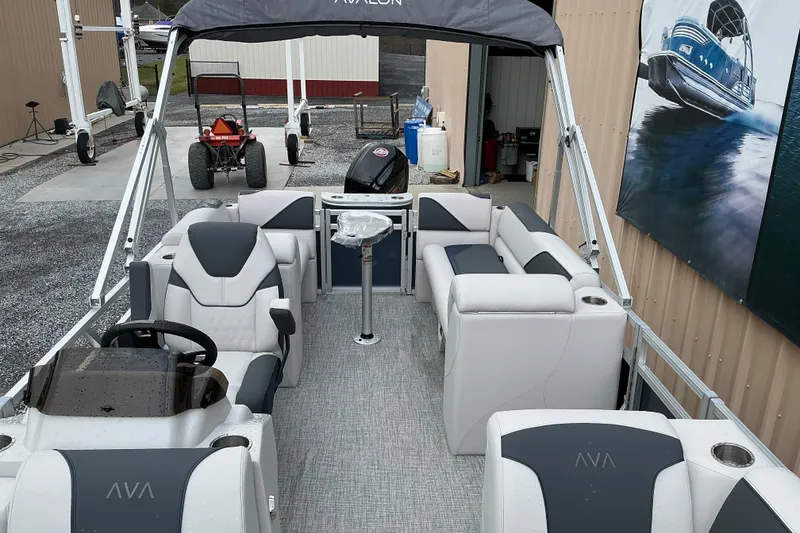 Slide: The Image of 2026 Avalon Venture Quad Lounge 21' pontoon boat with sleek seating and modern design. - 4