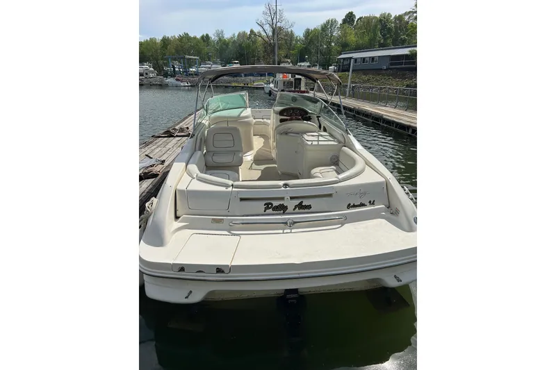 Slide: The Image of 1998 Sea Ray 280 Bow Rider docked at a marina, rear view. - 25