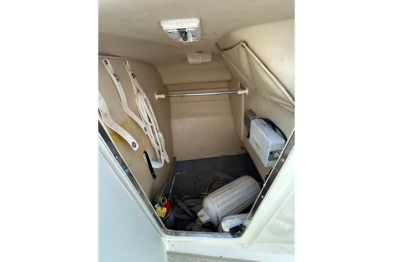 Slide: The Image of Interior storage compartment of a 1998 Sea Ray 280 Bow Rider boat. - 53