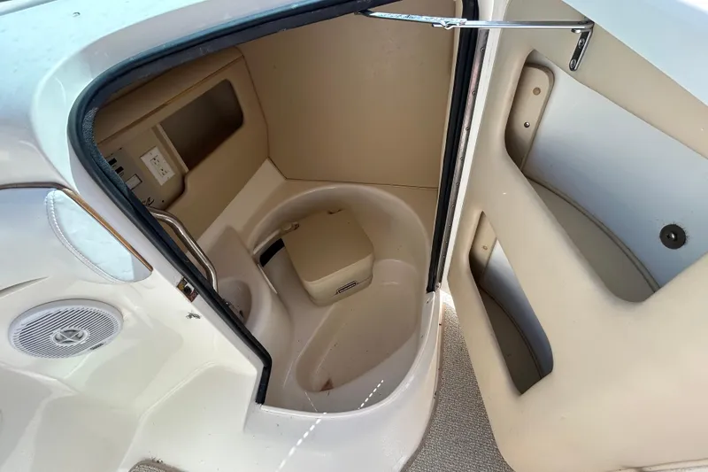 Slide: The Image of Interior view of a 1998 Sea Ray 280 Bow Rider boat compartment. - 60