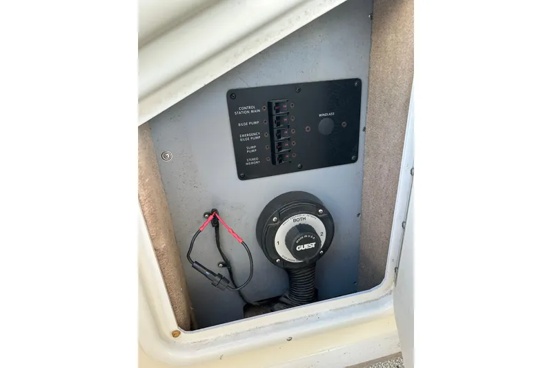 Slide: The Image of Electrical panel of a 1998 Sea Ray 280 Bow Rider boat, featuring control switches and wiring. - 69