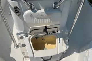 Slide: The Image of 2008 Boston Whaler 230 Dauntless boat interior with storage compartment open. - 12