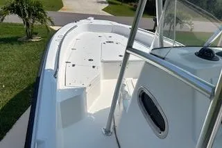 Slide: The Image of 2008 Boston Whaler 230 Dauntless boat deck, featuring spacious seating and sleek design. - 14