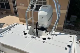 Slide: The Image of 2008 Boston Whaler 230 Dauntless boat with outboard motor and sturdy railing. - 15