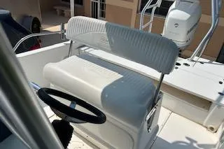 Slide: The Image of 2008 Boston Whaler 230 Dauntless boat helm with seating and steering wheel. - 18