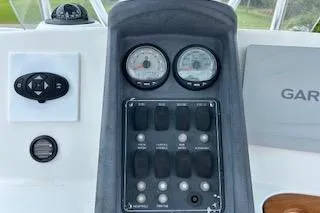 Slide: The Image of Dashboard of 2008 Boston Whaler 230 Dauntless with gauges and controls. - 19