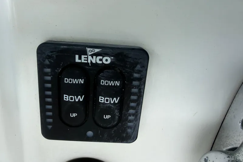 Slide: The Image of Lenco trim tab control panel on 2008 Boston Whaler 230 Dauntless boat. - 28