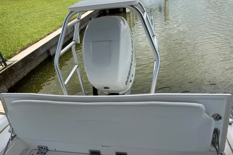 Slide: The Image of 2008 Boston Whaler 230 Dauntless boat with Mercury engine, docked by a canal. - 48