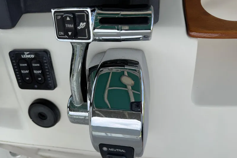 Slide: The Image of Close-up of 2008 Boston Whaler 230 Dauntless boat throttle and control panel. - 31