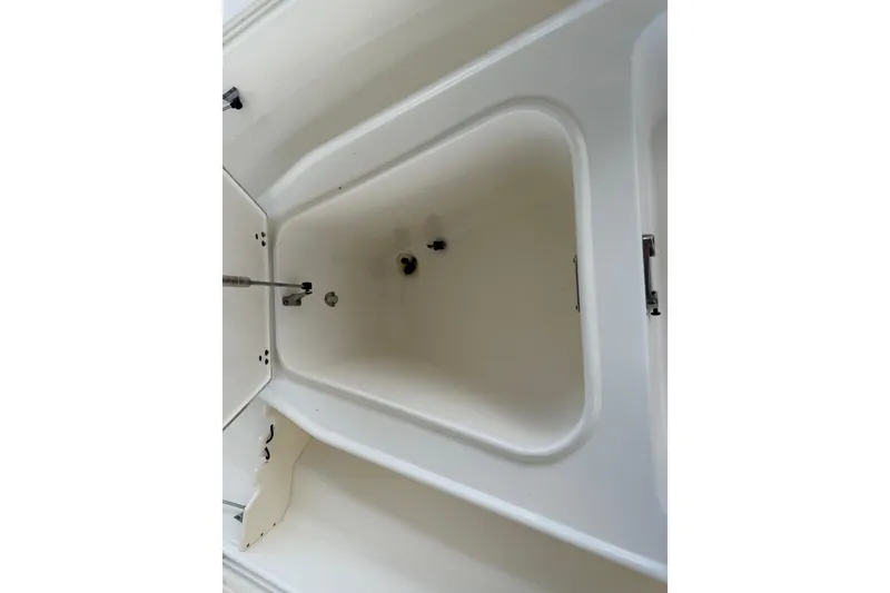 Slide: The Image of Interior view of a 2008 Boston Whaler 230 Dauntless boat compartment. - 44