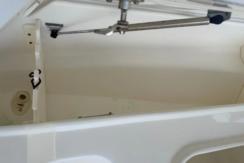 Slide: The Image of Open storage compartment of a 2008 Boston Whaler 230 Dauntless boat. - 42