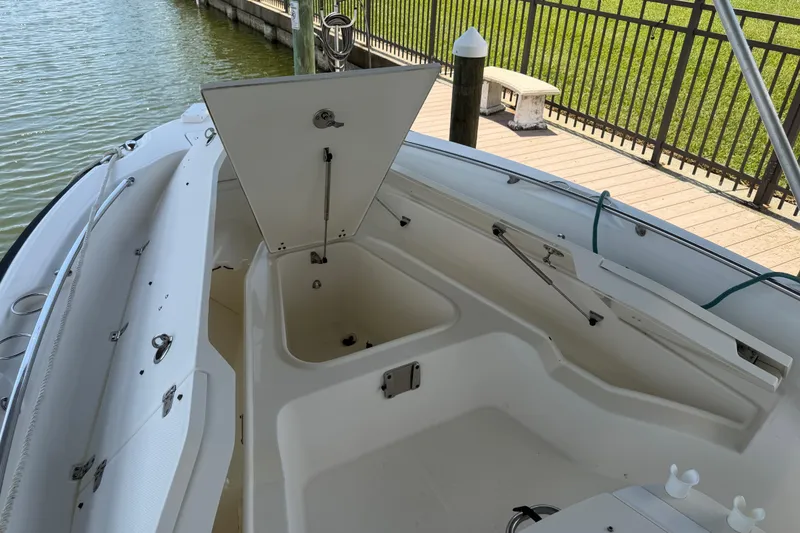 Slide: The Image of 2008 Boston Whaler 230 Dauntless boat interior with open storage compartment. - 43