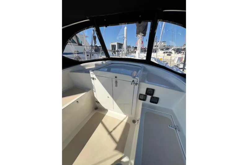 Slide: The Image of Interior view of 1978 Gulfstar Ketch cockpit with navigation instruments and seating. - 16