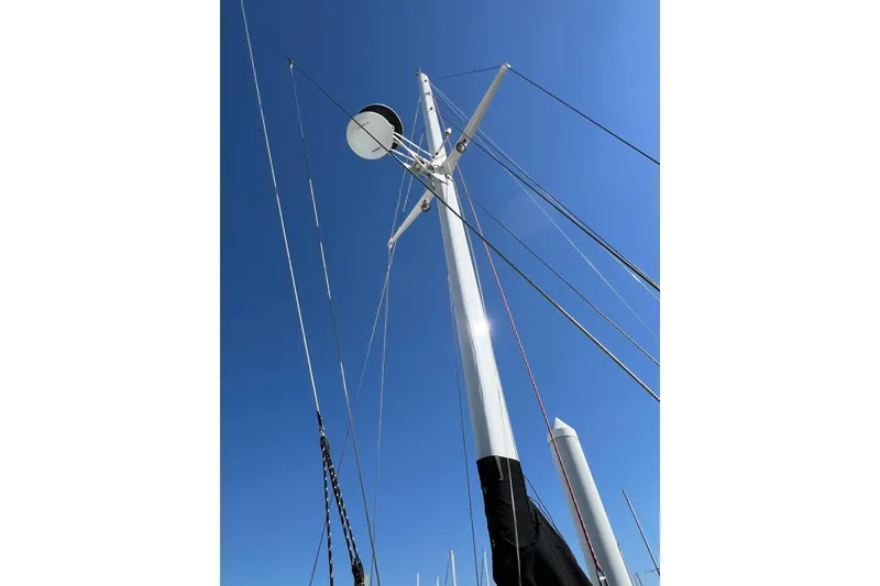 Slide: The Image of Mast of a 1978 Gulfstar Ketch sailboat against a clear blue sky. - 18