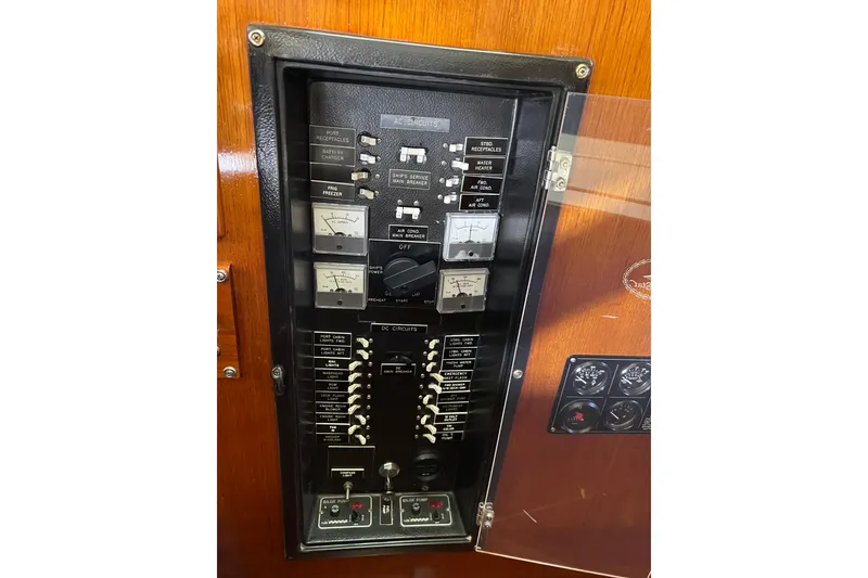 Slide: The Image of Electrical panel of a 1978 Gulfstar Ketch sailboat, featuring various switches and gauges. - 22