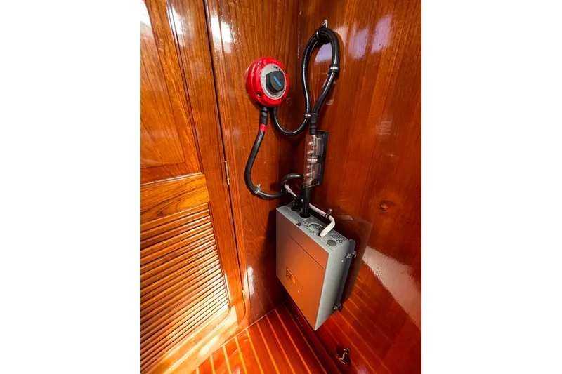 Slide: The Image of Electrical panel and wiring inside a 1978 Gulfstar Ketch, featuring polished wooden interior. - 27