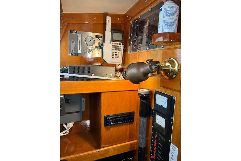 Slide: The Image of 1978 Gulfstar Ketch interior with navigation instruments and control panels. - 29