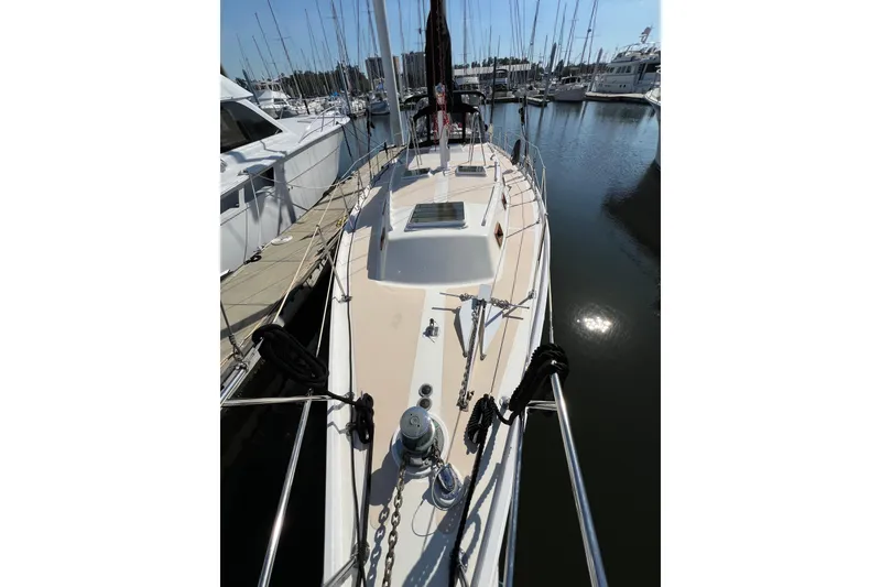Slide: The Image of 1978 Gulfstar Ketch sailboat docked in a marina, showcasing deck and rigging. - 3