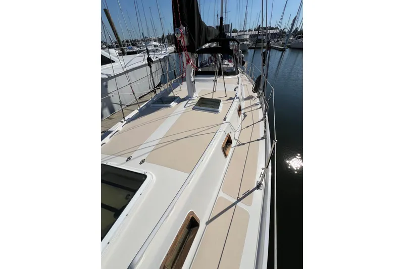 Slide: The Image of 1978 Gulfstar Ketch sailboat deck view in marina, showcasing sleek design and rigging. - 4