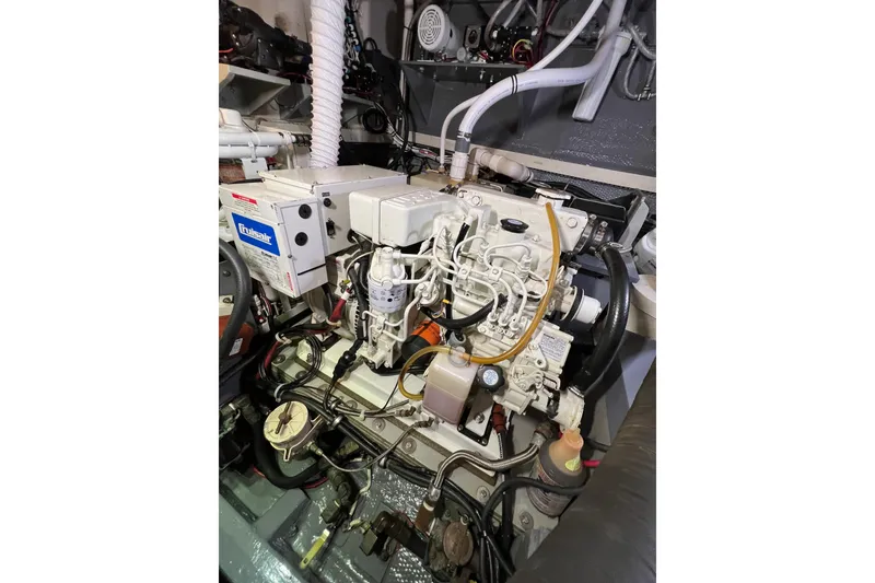 Slide: The Image of Engine room of a 1978 Gulfstar Ketch, featuring detailed mechanical components. - 46